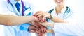 Doctors and nurses in a medical team stacking hands Royalty Free Stock Photo