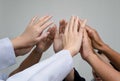 Doctors and nurses in a medical team stacking hands Royalty Free Stock Photo