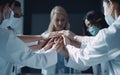 Doctors and nurses in a medical team stacking hands mutual support, encouragement health and medical concept. Generative ai Royalty Free Stock Photo