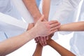 Doctors and nurses stacking hands