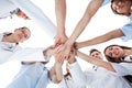 Doctors and nurses stacking hands