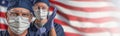 Doctors or Nurses In Medical Personal Protective Equipment PPE Against The American Flag Banner Royalty Free Stock Photo