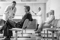 Doctors and patients in hospital waiting room Royalty Free Stock Photo