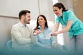 Doctors and patients speaking in the hospital waiting room Royalty Free Stock Photo