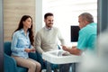Doctors and patients speaking in the hospital waiting room Royalty Free Stock Photo