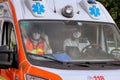 Doctors with protective mask inside an Italian ambulance