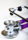 Doctors purple stethoscope isolated on a white background