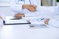 Doctors shaking hands to each other finishing up medical meeting Royalty Free Stock Photo