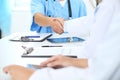 Doctors shaking hands to each other finishing up medical meeting Royalty Free Stock Photo