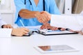 Doctors shaking hands to each other finishing up medical meeting Royalty Free Stock Photo