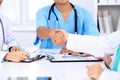 Doctors shaking hands to each other finishing up medical meeting Royalty Free Stock Photo