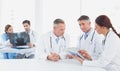 Doctors sitting together with x-rays Royalty Free Stock Photo