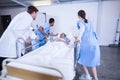 Doctors standing near patient bed Royalty Free Stock Photo