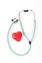 Doctors stethoscope and one red heart on white background Royalty Free Stock Photo