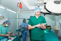 Doctors surgeons Standing and using tablet in the operating room,