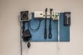 Doctors tools hung on wall of optometrists office copy