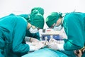 Doctors are treating patients in operating rooms. The surgeon team is working in the operating room. The surgeon is saving the Royalty Free Stock Photo