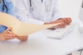 Doctors using computer looking at files Royalty Free Stock Photo