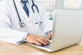 Doctors using laptop