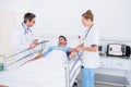 Doctors visiting a male patient in hospital Royalty Free Stock Photo