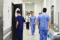 Doctors walking through corridor in hospital