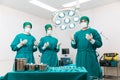 Doctors are wearing protective gloves, examining and treating patients in operating room equipped with modern medical equipment Royalty Free Stock Photo