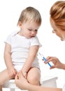 Doctors woman hand with syringe vaccinating child baby flu injection shot isolated on a white Royalty Free Stock Photo