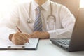 Doctor working with medical statistics and financial reports in office Royalty Free Stock Photo