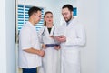 Doctors working in hospital and discussing over medical reports. Medical staff analyzing and working at clinic Royalty Free Stock Photo