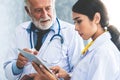 Doctors working with tablet computer at hospital. Royalty Free Stock Photo