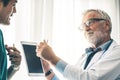 Doctors working with tablet computer at hospital. Royalty Free Stock Photo