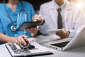 Doctors working together on digital tablet healthcare doctor technology tablet using computer. Royalty Free Stock Photo