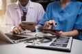 Doctors working together on digital tablet healthcare doctor technology tablet using computer. Royalty Free Stock Photo