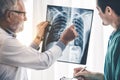 Doctors working with x ray film of patient chest. Royalty Free Stock Photo