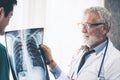 Doctors working with x ray film of patient chest. Royalty Free Stock Photo