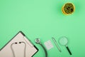 doctors workplace - medical tablet, stethoscope, pills and magnifying glass Royalty Free Stock Photo