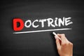 Doctrine text on blackboard Royalty Free Stock Photo