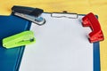 Document holder, sketch-board with hole puncher and stapler. Royalty Free Stock Photo