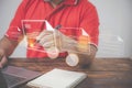 Document management, paperless office concept. A man uses a pen to sign an electronic signature approved on an electronic document Royalty Free Stock Photo