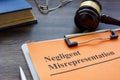 Document about Negligent misrepresentation and a gavel. Royalty Free Stock Photo