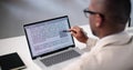 Document Proofreading: African American Man Editing Script Online Spelling Royalty Free Stock Photo