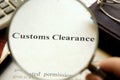 Document with title Customs Clearance on a table. Royalty Free Stock Photo
