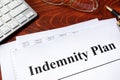 Document with title Indemnity Plan on a table. Royalty Free Stock Photo