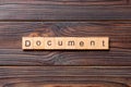 Document word written on wood block. Document text on cement table for your desing, concept