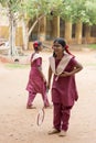 Documentary editorial image. Active indian preschool girl and boy playing badminton in outdoor court in summer. School sports for Royalty Free Stock Photo