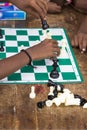 Documentary editorial image. Children playing chess at the table. the concept of childhood and board games, brain development and