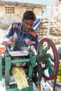 Documentary editorial. PUDUCHERY, PONDICHERY, TAMIL NADU, INDIA - March circa, 2018. Unidentified man Worker Extract Cane Juice Royalty Free Stock Photo