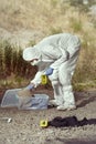 Documentation of suspicious evidences by technician in terrain Royalty Free Stock Photo