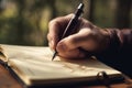 Documenting thoughts, Close-up of man\'s hand writing in his notebook