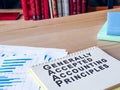 Documents about Generally Accepted Accounting Principles GAAP on the desk.